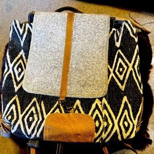 Myra backpack NWT, beautiful fur flap with lock closure.